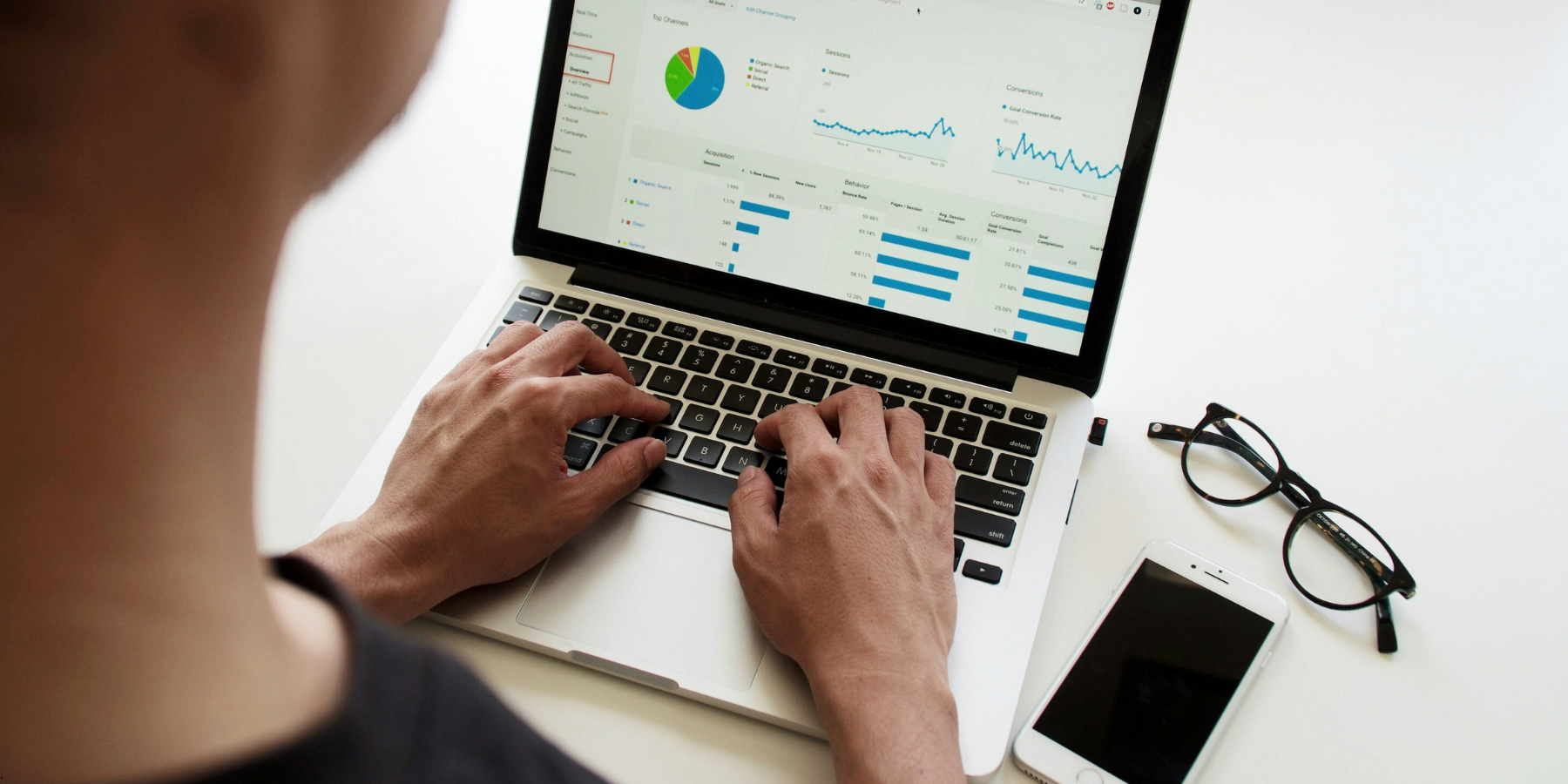 Person on their laptop looking at graphs Person on their laptop looking at graphs