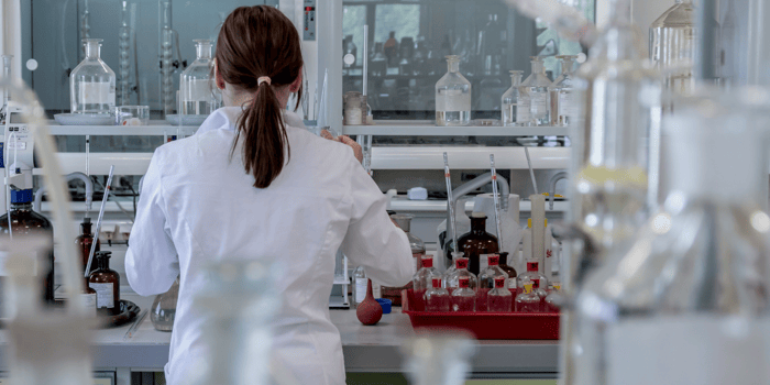 Woman in a lab working on a chemistry experiment