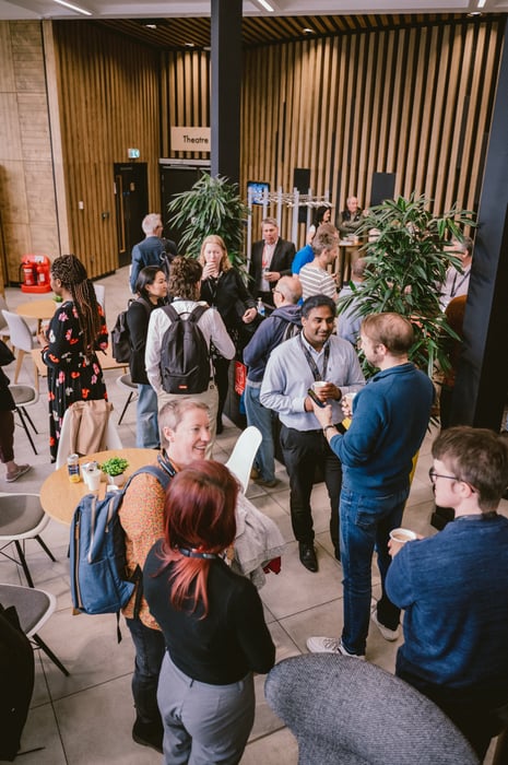 People talking at the Catalyst at a conference